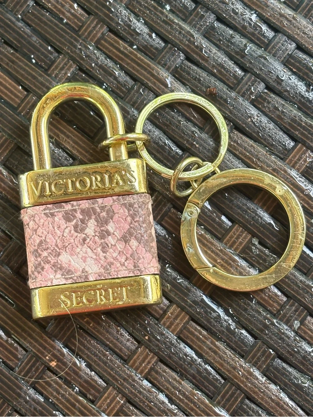 Victoria's Secret padlock keychain features a rose gold finish and a pink snakes
